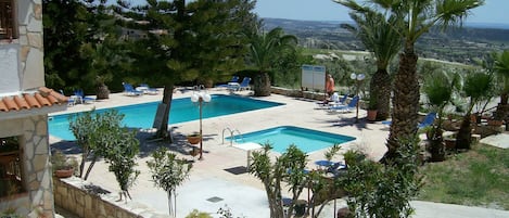 Apartment, 1 Bedroom | Pool | Seasonal outdoor pool, pool umbrellas, sun loungers