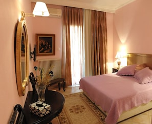 Double or Twin Room | Minibar, in-room safe, individually decorated, blackout curtains