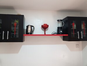 Full-sized fridge, microwave, stovetop, electric kettle