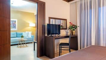 Deluxe Suite, Private Pool | Minibar, in-room safe, desk, laptop workspace
