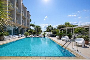 Seasonal outdoor pool, an infinity pool, lifeguards on site