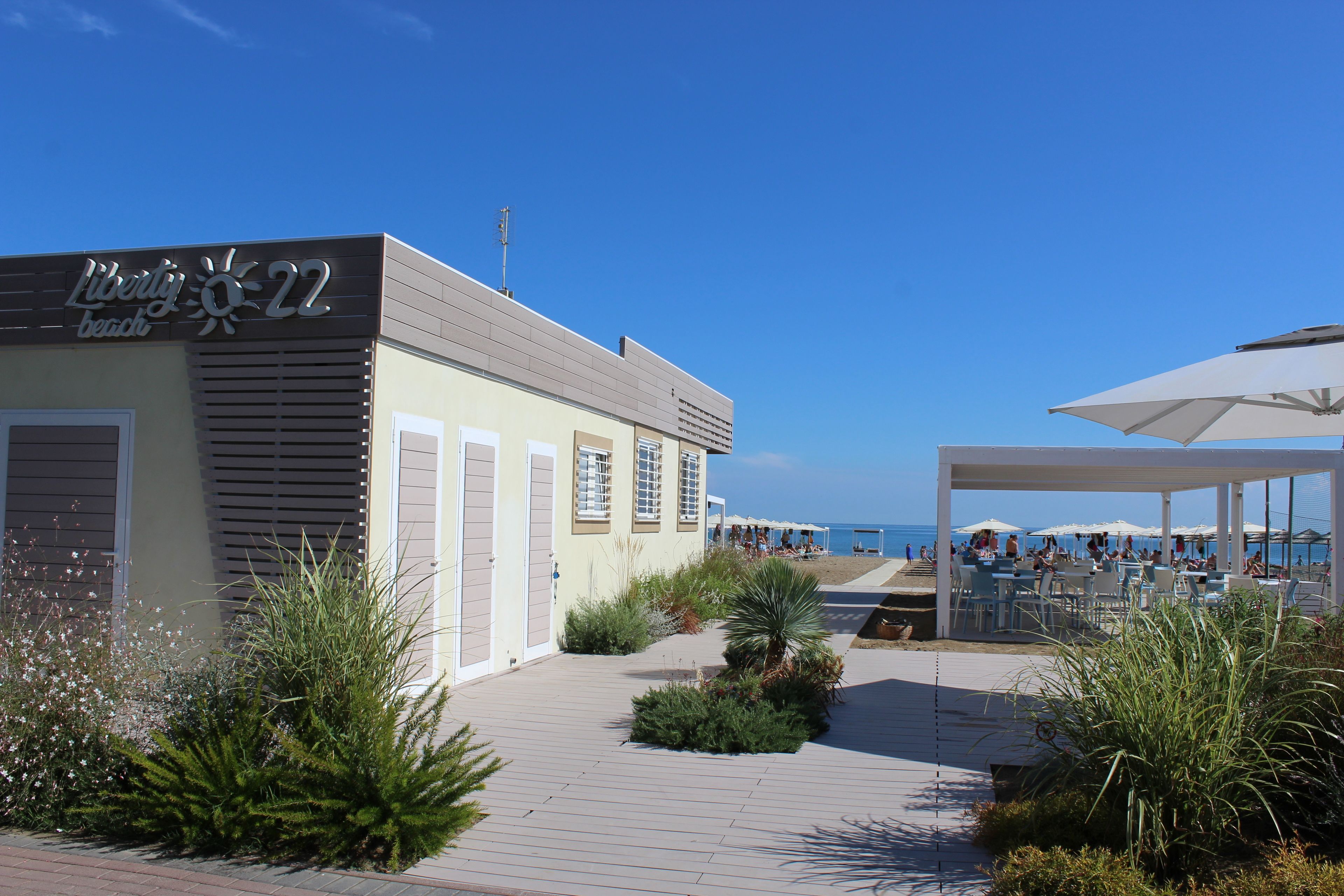 private beach, sun-loungers, beach umbrellas, beach volleyball