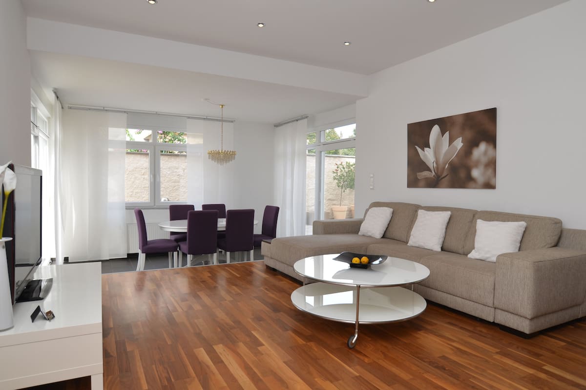 Deluxe Apartment, 2 Bedrooms, Terrace, Garden View | Living area | Flat-screen TV