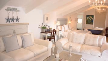 Luxury Double Room, Multiple Beds | Living area | TV, DVD player