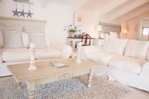 Luxury Double Room, Multiple Beds | Living area | TV, DVD player