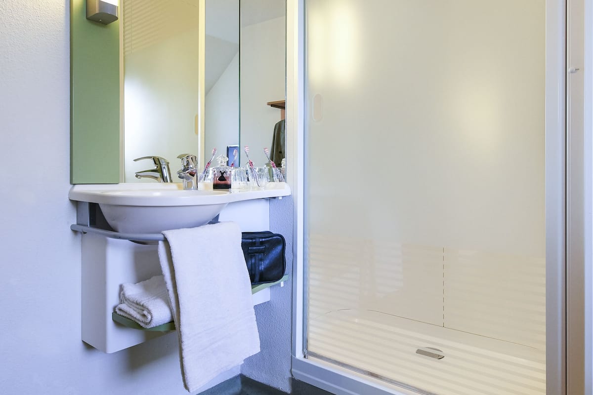 shower, eco-friendly toiletries, hair dryer, towels