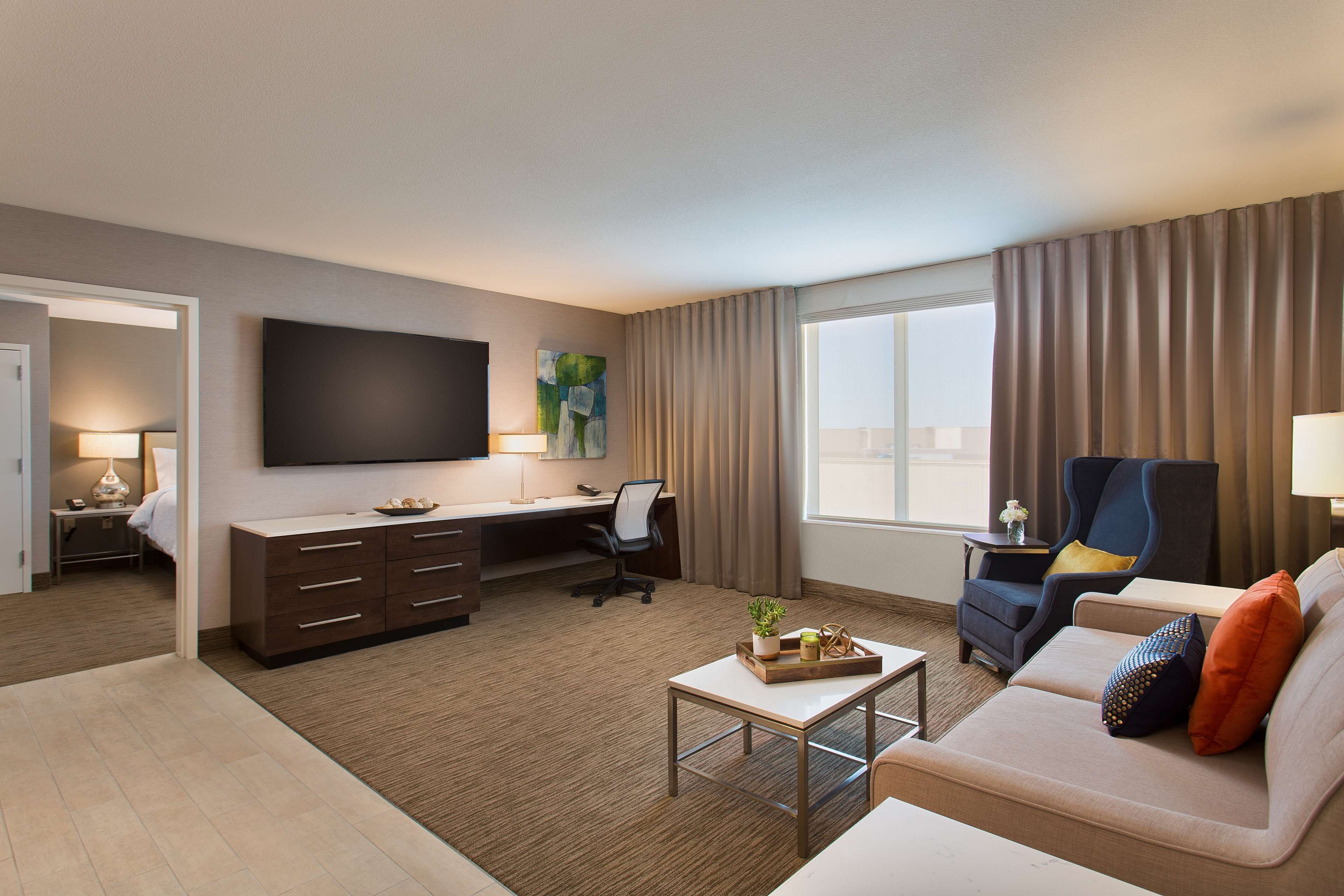 premium bedding, pillow-top beds, desk, laptop workspace