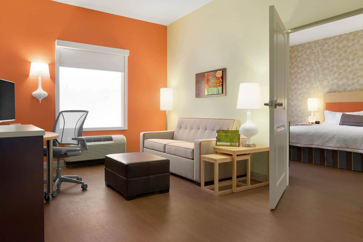 Premium bedding, desk, laptop workspace, blackout curtains
