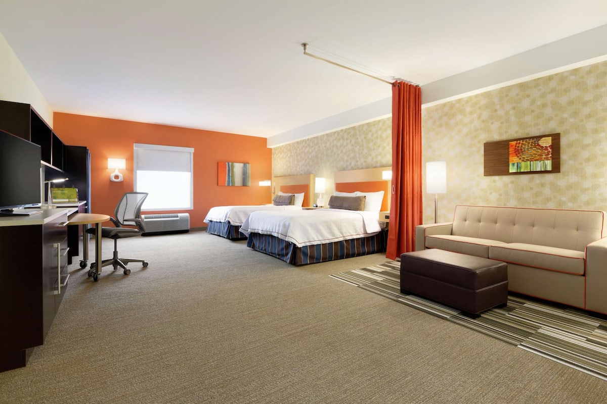 Premium bedding, desk, laptop workspace, blackout curtains