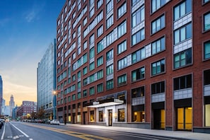 A hotel with a brick facade, multiple windows, and a marquee sign. - Hilton Brooklyn Downtown NYC (Brooklyn)