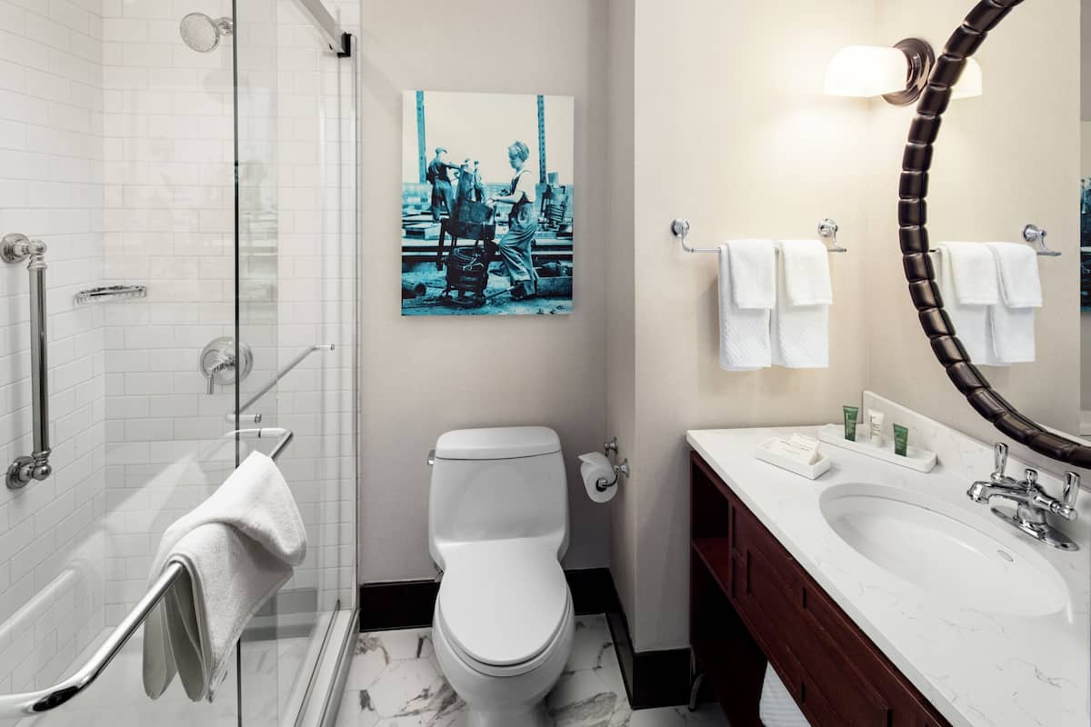 designer toiletries, hair dryer, towels