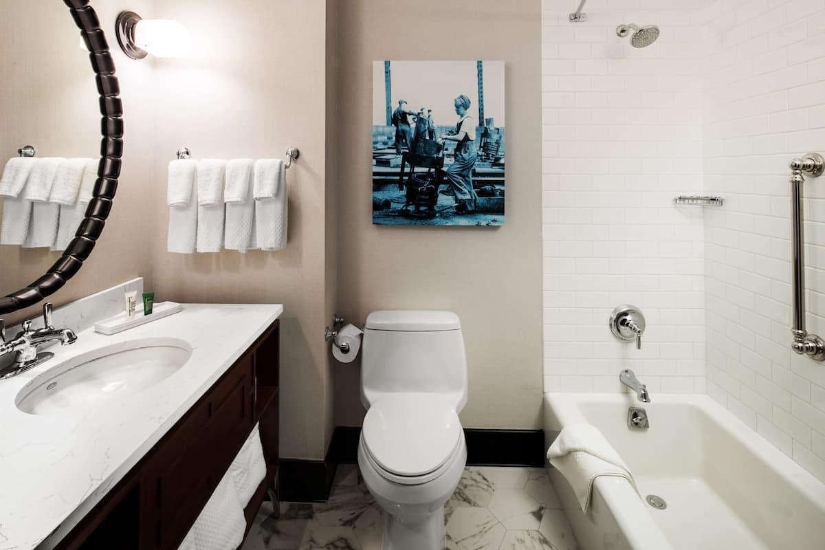 designer toiletries, hair dryer, towels