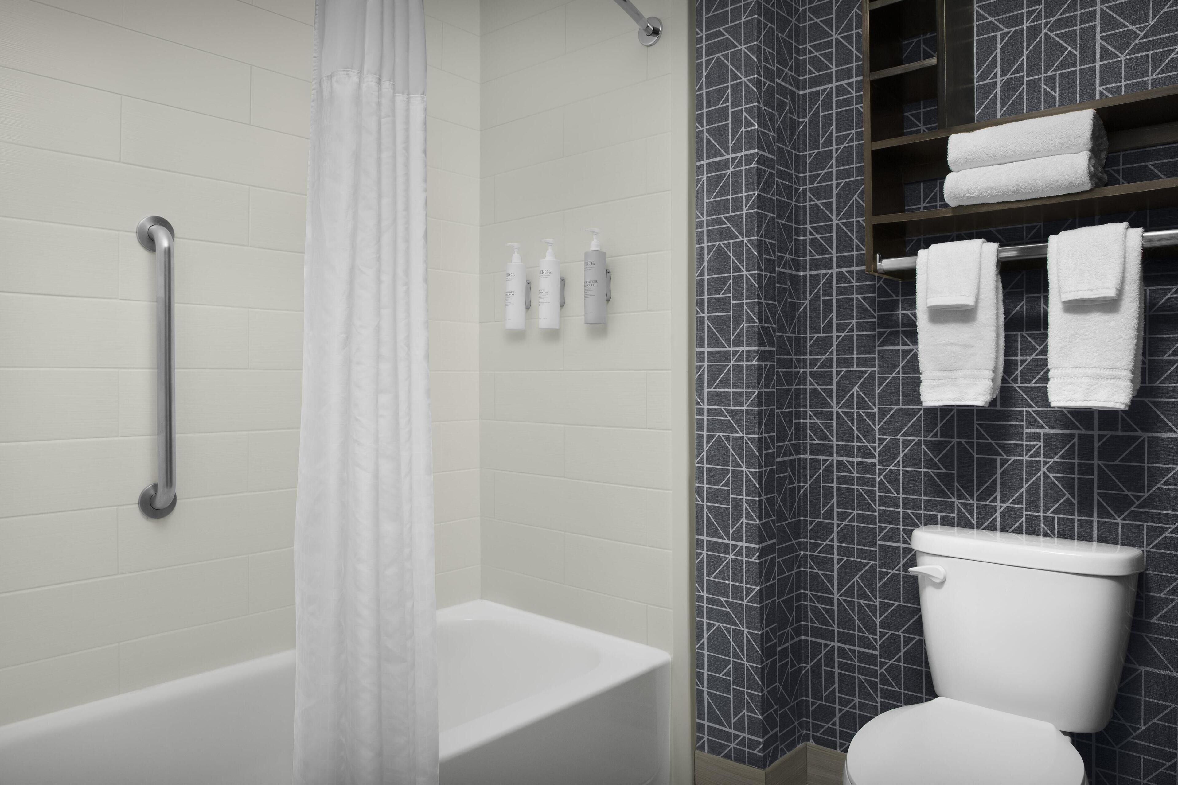 combined shower/bathtub, free toiletries, hair dryer, towels