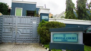 A gated entrance with a sign reading "CRYSTAL COURT LEKKI". - Crystal Court Lekki (Lekki)