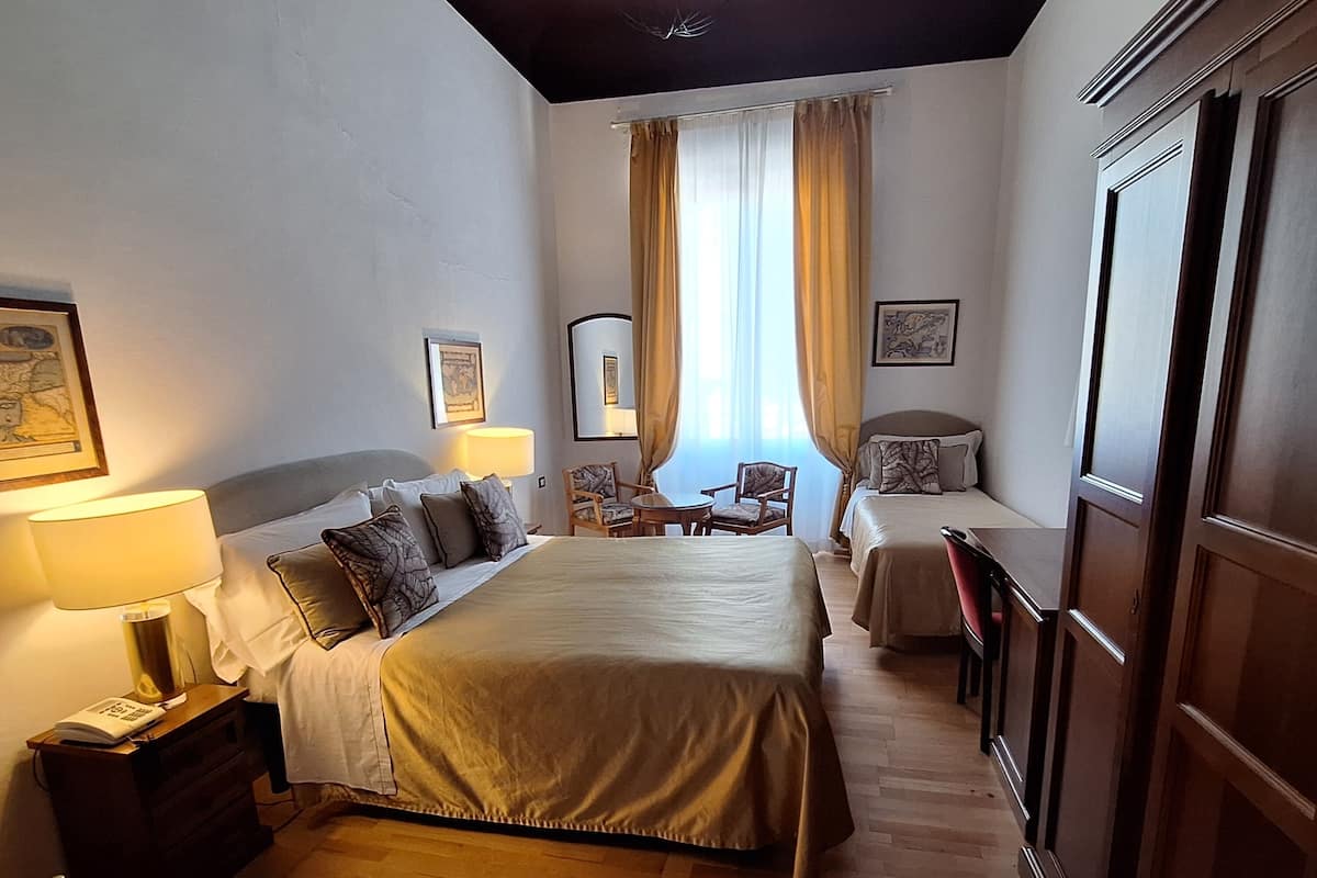 Deluxe Triple Room (Duomo View) | 1 bedroom, in-room safe, desk, laptop workspace