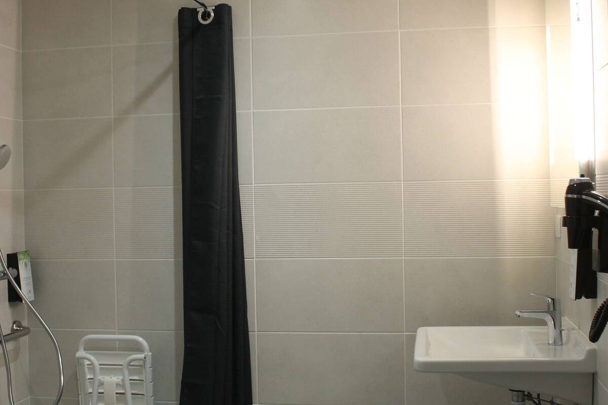 family room, multiple beds | bathroom | shower, eco-friendly toiletries, hair dryer, towels