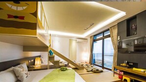 A bedroom with a bunk bed, a staircase, a large window with a view, and a TV on a shelf. - Easylife B&B  (Dongshan)