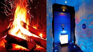 A room with a fireplace and a blue-lit ice wall. - Hotel Montanara (Ischgl)