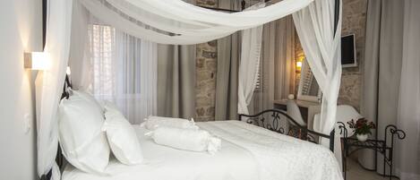 Premium bedding, down duvets, in-room safe, desk