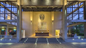 A spacious lobby with a reception desk, large windows, and a chandelier. - Anantara Kalutara Resort (Kalutara)