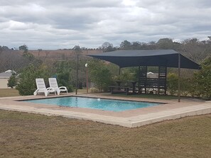 Outdoor pool, pool umbrellas, sun loungers