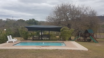 Outdoor pool, pool umbrellas, pool loungers