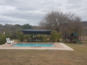 Outdoor pool, pool umbrellas, pool loungers