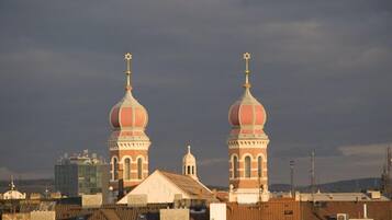 A building with two prominent domes and a smaller adjacent structure.