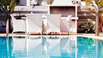 Outdoor pool, pool umbrellas, pool loungers