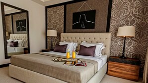 Suite estudio, vista al mar | Ropa de cama de alta calidad y minibar 