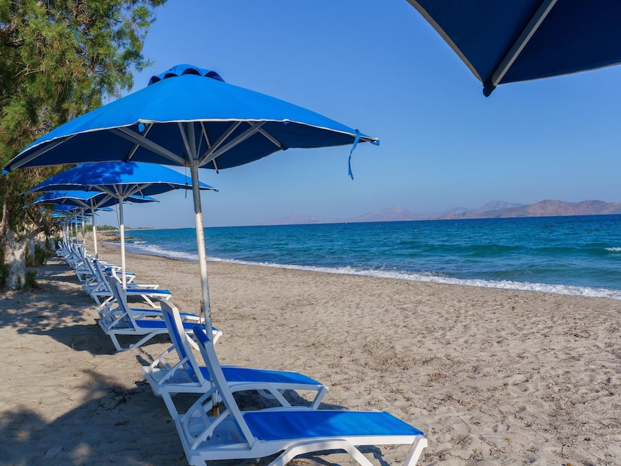 On the beach, sun loungers, beach umbrellas
