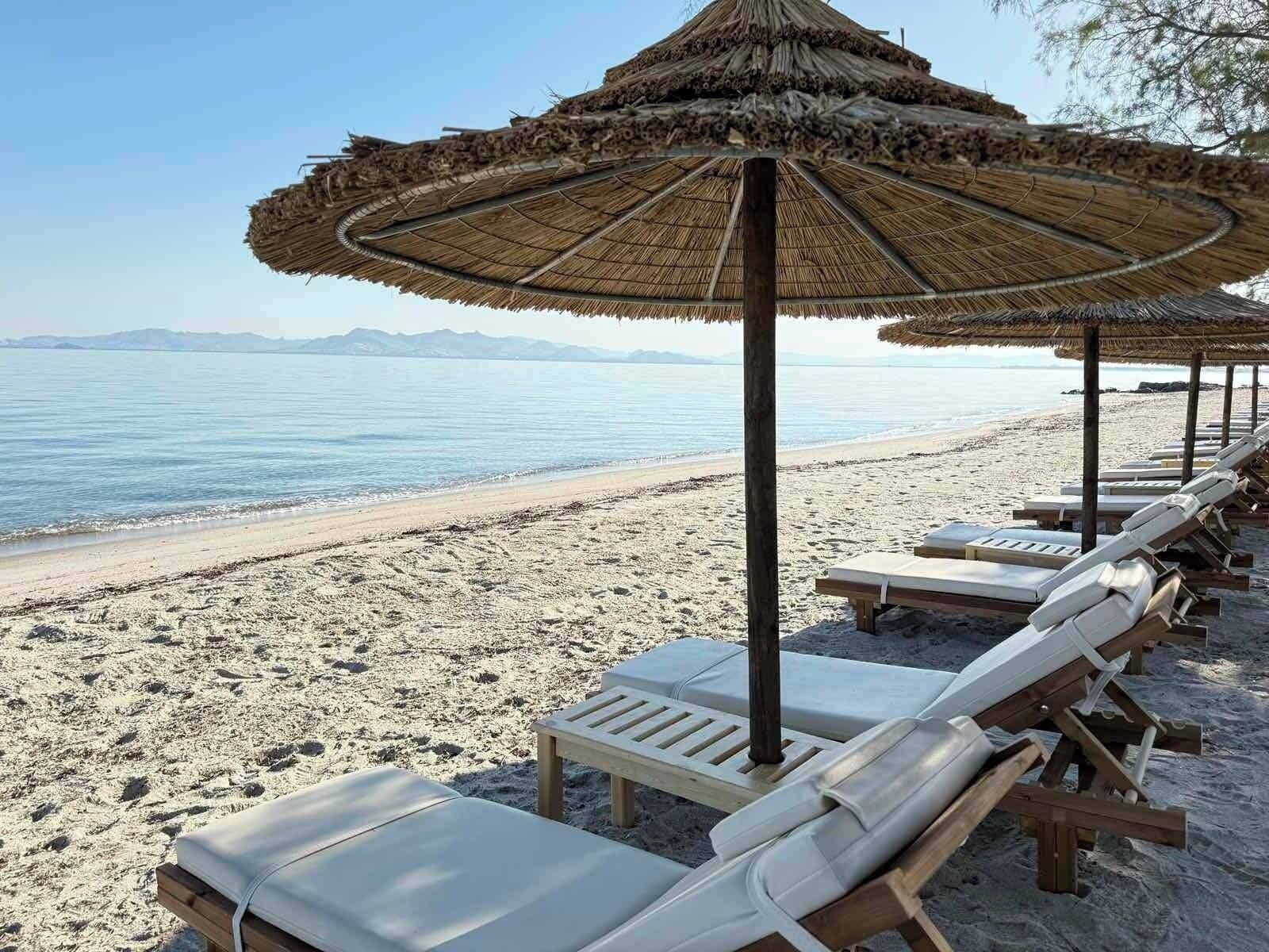 On the beach, sun-loungers, beach umbrellas