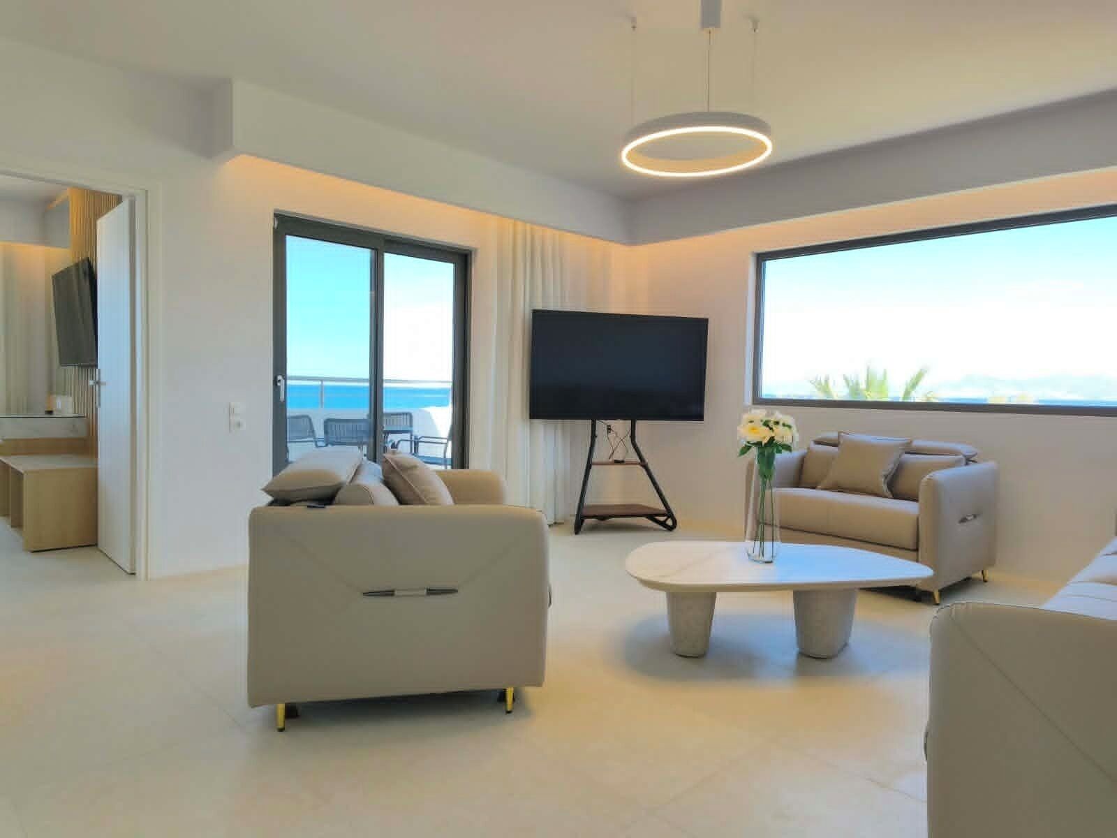 King Suite Ocean View | Living area | Flat-screen TV