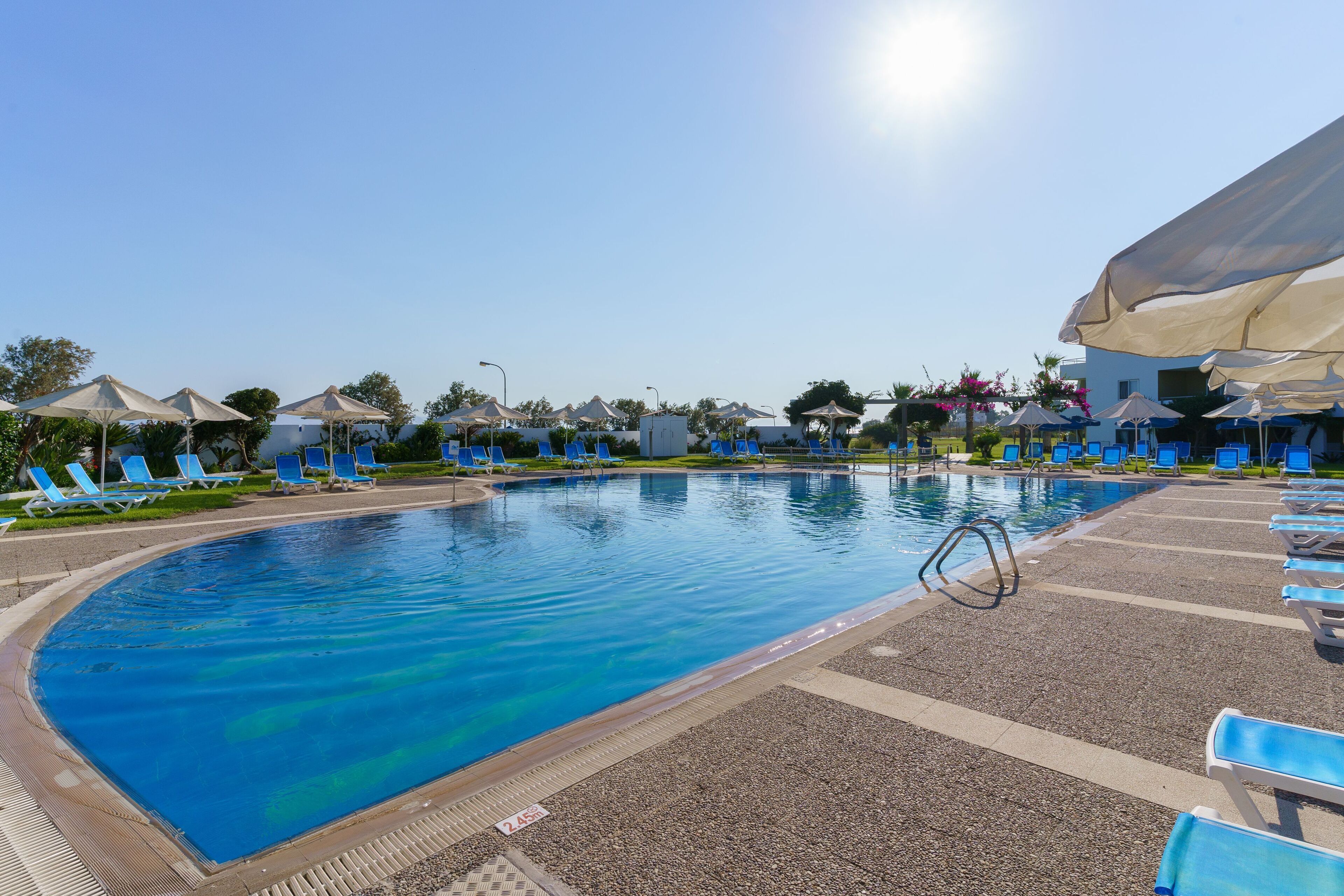 seasonal outdoor pool, pool umbrellas, pool loungers