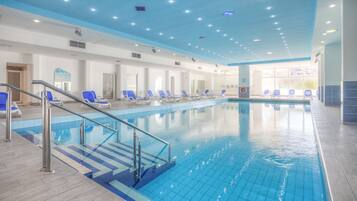 Indoor pool, seasonal outdoor pool, pool umbrellas, pool loungers