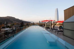 Relax by the rooftop pool with a stunning view of the city skyline.