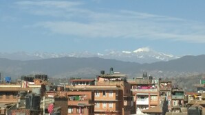 A mountainous landscape with snow-capped peaks in the background. - Sunny Guest House and Cafe (Bhaktapur)