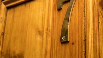 A wooden door with a brass number '7' handle.