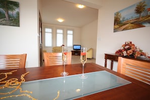 Enjoy meals for two at a beautifully set table with champagne flutes.