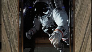An elevator with a space-themed mural of an astronaut.