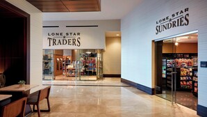A mall interior with a Lone Star Traders store and a Sundries store.