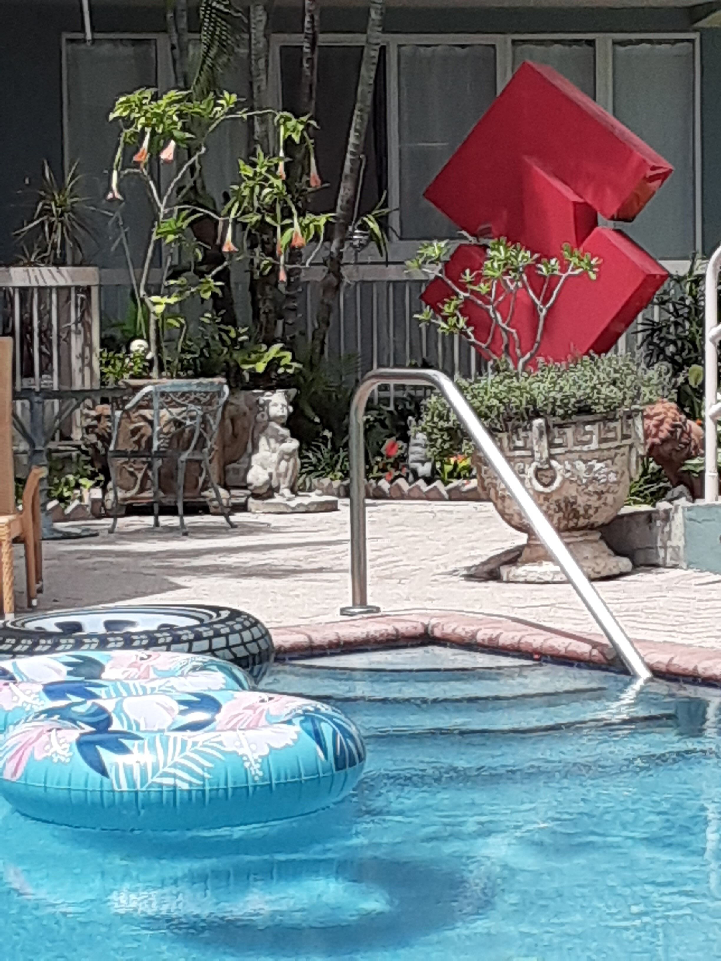 outdoor pool, pool umbrellas, pool loungers
