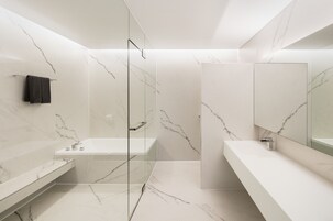 Combined shower/bathtub, deep-soaking bathtub, hair dryer, towels