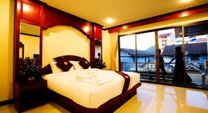 Deluxe Double Room, Balcony | Minibar, in-room safe, desk, blackout drapes - Baan Sudarat (Patong)