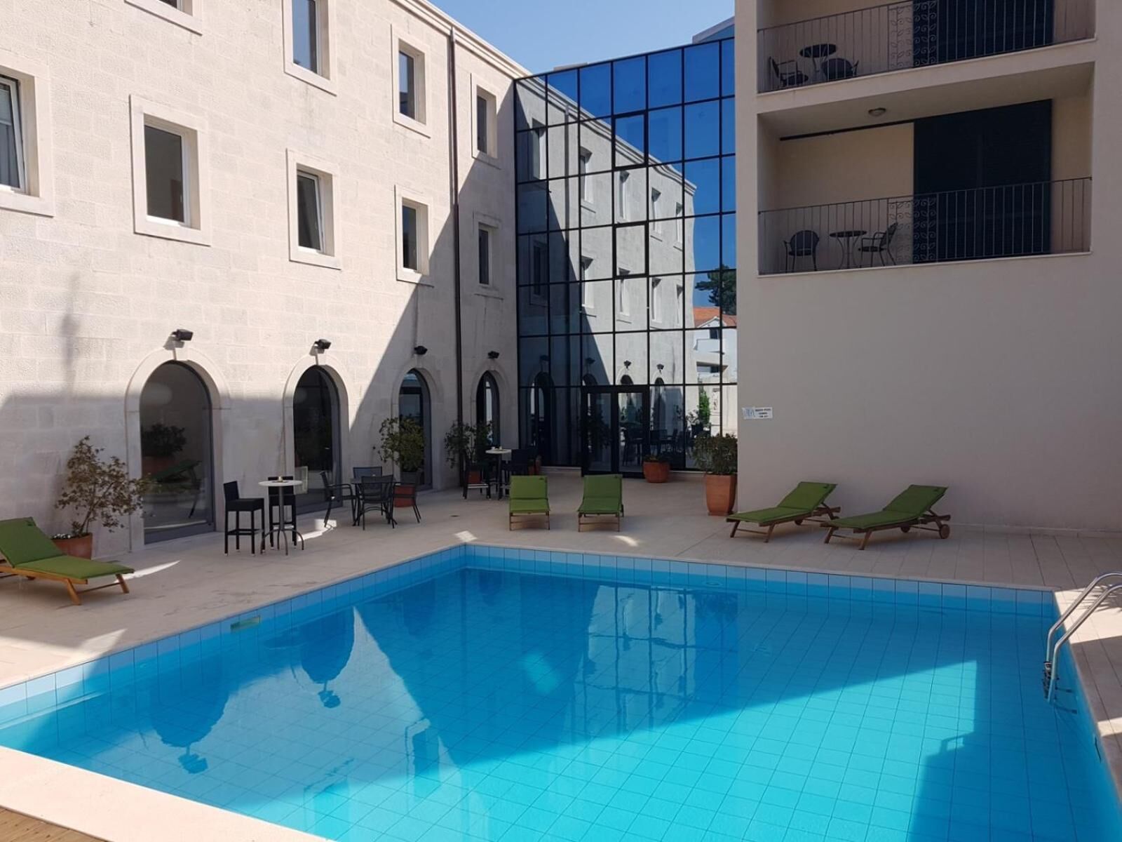 seasonal outdoor pool, pool umbrellas, pool loungers