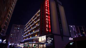 A multi-story hotel with a prominent red sign reading "MARDIN HOTEL".