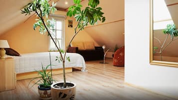 Standard Quadruple Room, Private Bathroom, Garden View | Living area | Flat-screen TV