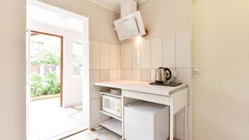 Fridge, electric kettle, cookware/dishes/utensils