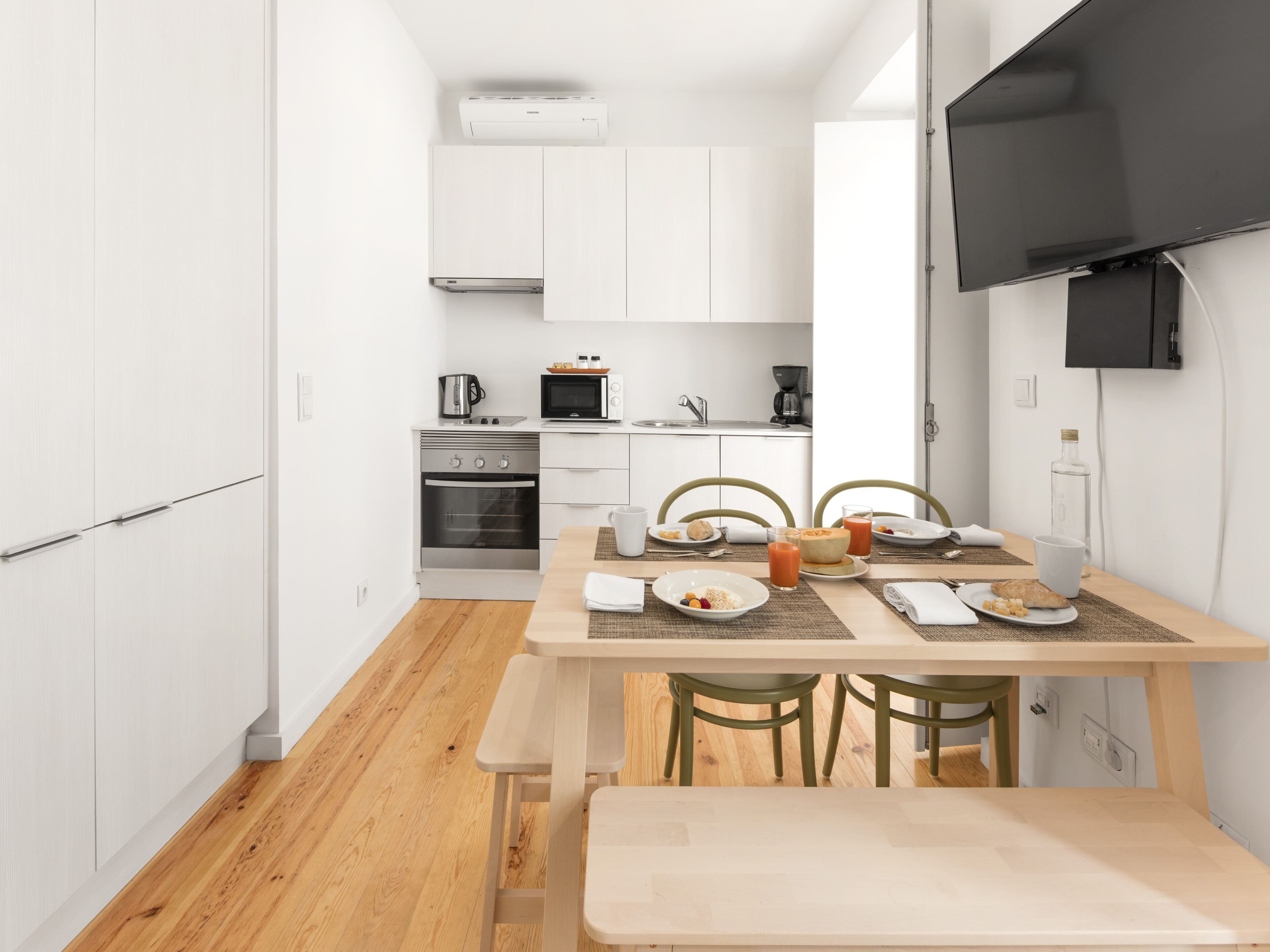 Deluxe Two-Bedroom Apartment | Private kitchen | Coffee/tea maker, mini-fridge, microwave, oven
