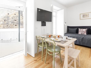Deluxe Two-Bedroom Apartment | Living area | 34-inch flat-screen TV with satellite channels, TV - LSA Castelo S. Jorge by Numa (Lisbon)